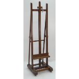 GOOD OAK PICTURE EASEL with adjustable support on casters, 210cms high