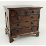 CHARMING GEORGE III STYLE MAHOGANY MINIATURE CHEST OF DRAWERS, two short, three long, on bracket