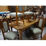 MODERN OAK DINING TABLE with six carved and upholstered antique style dining chairs