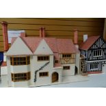 LARGE EDWARDIAN TYPE DOLLS HOUSE and a similar Tudor type dolls house with contents (2)