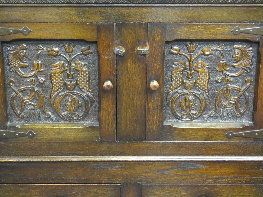 VINTAGE CONTINENTAL CARVED OAK BUFFET SIDEBOARD having twin upper doors with bird and mask detail - Image 3 of 4