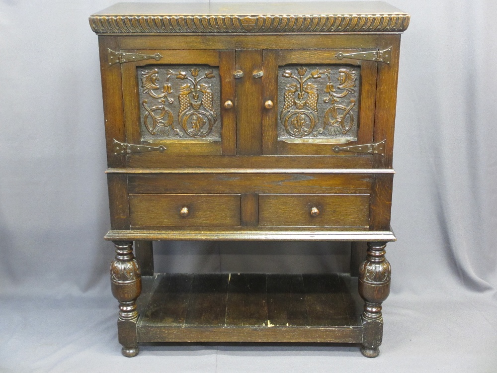 VINTAGE CONTINENTAL CARVED OAK BUFFET SIDEBOARD having twin upper doors with bird and mask detail