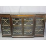 MAHOGANY FOUR DOOR BREAK-FRONT BOOKCASE, edge carved decoration to the top of 13 pane astragal