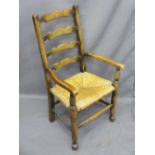 ANTIQUE STYLE LADDERBACK CHILD'S ARMCHAIR, rush seated, 77cms H, 41.5cms W, 28.5cms seat D