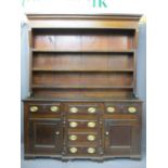 CIRCA 1840 NORTH WALES BREAKFRONT DRESSER in oak and pine, the three shelf rack with wide backboards