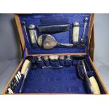 LADIES FITTED TRAVEL/VANITY CASE with protective cover, 24 pieces including silver topped bottles,