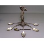 CAST LEAD FIGURINE OF A NAKED FEMALE and six German silver teaspoons, stamped 'W N F 90', 3.7 troy