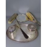 SEVEN PIECE DRESSING TABLE SET including an oval tray, mixed Birmingham hallmarks, 1916-1924, one