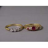 TWO EIGHTEEN CARAT GOLD DRESS RINGS to include a three stone individual claw set ring, 2.4grms, size