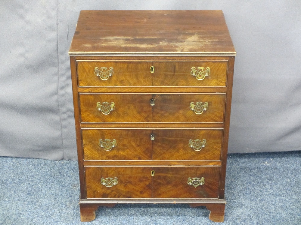 NEATLY PROPORTIONED VINTAGE MAHOGANY CHEST of four drawers having pierced brass backplates and swing