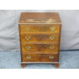 NEATLY PROPORTIONED VINTAGE MAHOGANY CHEST of four drawers having pierced brass backplates and swing