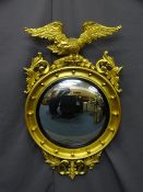 REPRODUCTION REGENCY STYLE CONVEX WALL MIRROR, bobble decorated frame with leaf swags and eagle