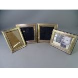 FOUR HALLMARKED SILVER PHOTOGRAPH FRAMES including a vintage example, 17 x 12.5cms and three