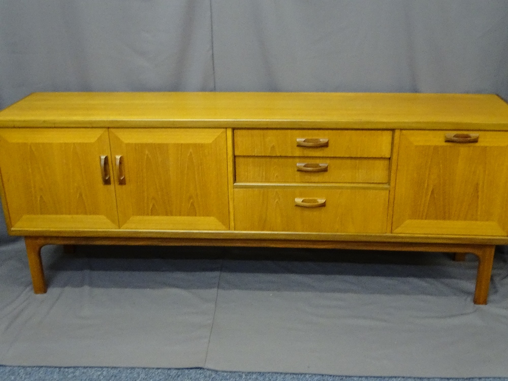 EXCELLENT G-PLAN LONG TEAK SIDEBOARD having three centre drawers with flanking drop down and opening