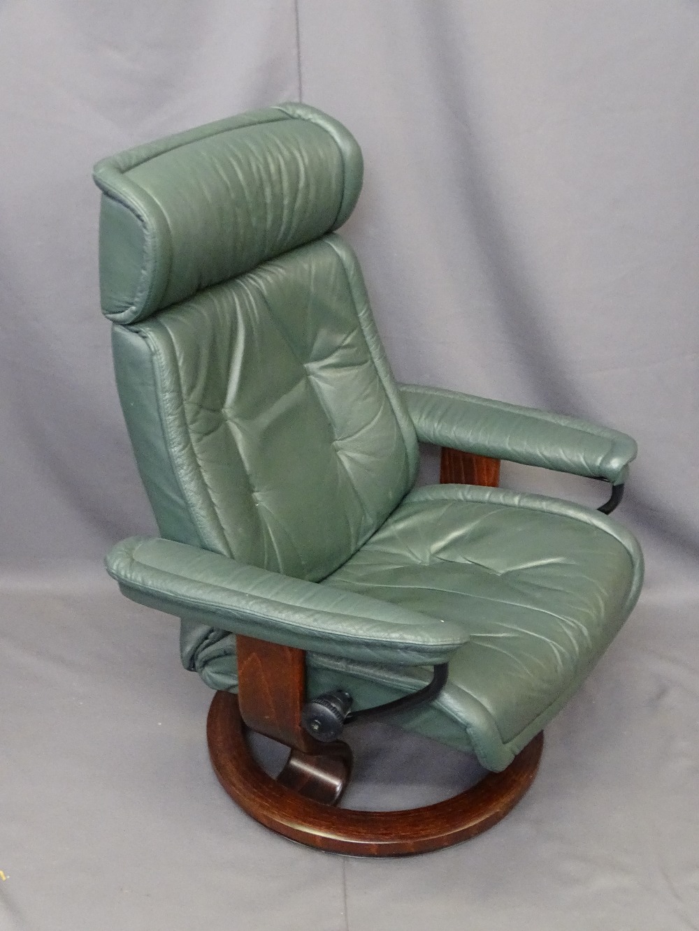 'STRESSLESS' SWIVEL ARMCHAIR by Ekornes, Norway, modern green leather effect, open armed with swivel