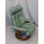 'STRESSLESS' SWIVEL ARMCHAIR by Ekornes, Norway, modern green leather effect, open armed with swivel