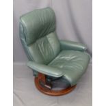 'STRESSLESS' SWIVEL ARMCHAIR by Ekornes, Norway, modern green leather effect with closed arms,