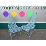 PAIR OF GREEN METAL GARDEN CHAIRS, interesting swept scroll seats and back, 92cms H, 45cms W,