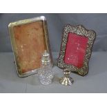 SILVER ITEMS - two portrait frames, silver topped sugar sifter and a short candleholder