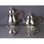 SILVER FOUR PIECE TEA & COFFEE SET in Queen Anne style, domed tops with silver finials over