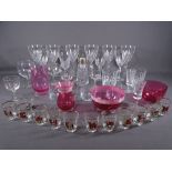 GLASSWARE - a quantity of drinking glasses, cranberry glassware ETC