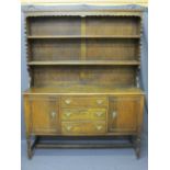 CIRCA 1930 OAK DRESSER with two shelf rack over a base section of three central drawers and flanking