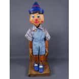 WOODEN PINOCCHIO PUPPET in the form of one bookend