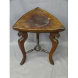 INTERESTING TRIANGULAR TOPPED HARDWOOD STOOL on shaped supports and conjoining stretcher, 46.5cms H