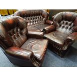 THREE PIECE LOUNGE SUITE, burgundy leather effect, button backed comprising two seater couch,