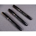 MABIE TODD - Three vintage (1940s-1950s) lack Swan Mabie Todd fountain pens with gold trim and