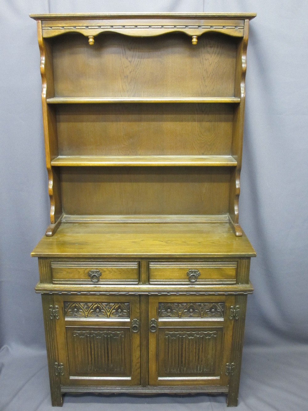 TWO ITEMS OF PRIORY STYLE FURNITURE with linenfold carving including a two door, two drawer dresser, - Image 4 of 5