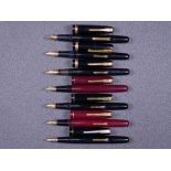 WATERMAN - Two vintage (late 1940s) Waterman Taperite fountain pens - one black, one maroon - with