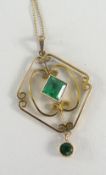 YELLOW METAL PENDANT set with green stones on 15ct yellow gold chain, in box