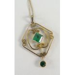 YELLOW METAL PENDANT set with green stones on 15ct yellow gold chain, in box