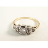 ART DECO DESIGN SEVEN STONE DIAMOND RING in yellow metal setting, the primary stone 0.3cts