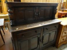 ERCOL CUPBOARD in the reproduction Elizabethan style, stained oak