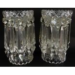 PAIR OF VICTORIAN CLEAR GLASS TABLE LUSTRES of trumpet form with two registers of faceted drops,