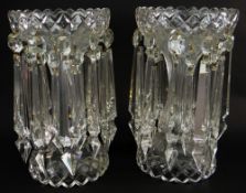 PAIR OF VICTORIAN CLEAR GLASS TABLE LUSTRES of trumpet form with two registers of faceted drops,