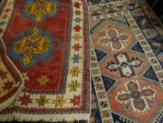 TWO RUGS comprising Kazak Karochov and a Caucasian rug, largest 209 x 132cms