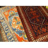 TWO CAUCASIAN RUGS comprising one red and indigo, the other red, yellow and blue, the largest 225
