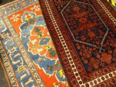 TWO CAUCASIAN RUGS comprising one red and indigo, the other red, yellow and blue, the largest 225