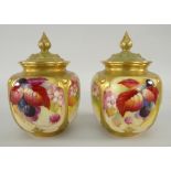 TWO SIMILAR ROYAL WORCESTER POT POURRI VASES AND COVERS hand painted with autumnal berries and