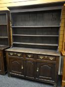 18TH CENTURY OAK WELSH HIGH DRESSER, boarded plate rack, three shelves, three frieze drawers and two