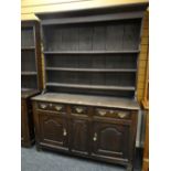 18TH CENTURY OAK WELSH HIGH DRESSER, boarded plate rack, three shelves, three frieze drawers and two