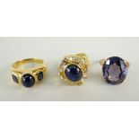 THREE YELLOW METAL DRESS RINGS set with assorted precious stones including diamonds and sapphires,