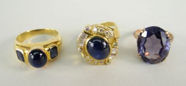 THREE YELLOW METAL DRESS RINGS set with assorted precious stones including diamonds and sapphires,