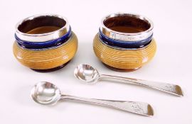 ROYAL DOULTON STONEWARE SALTS with silver collars and two hallmarked silver spoons