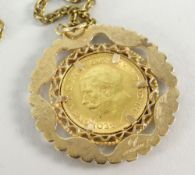 GEORGE V GOLD HALF SOVEREIGN DATED 1914 within a 9ct gold openwork mount, on chain