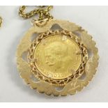 GEORGE V GOLD HALF SOVEREIGN DATED 1914 within a 9ct gold openwork mount, on chain