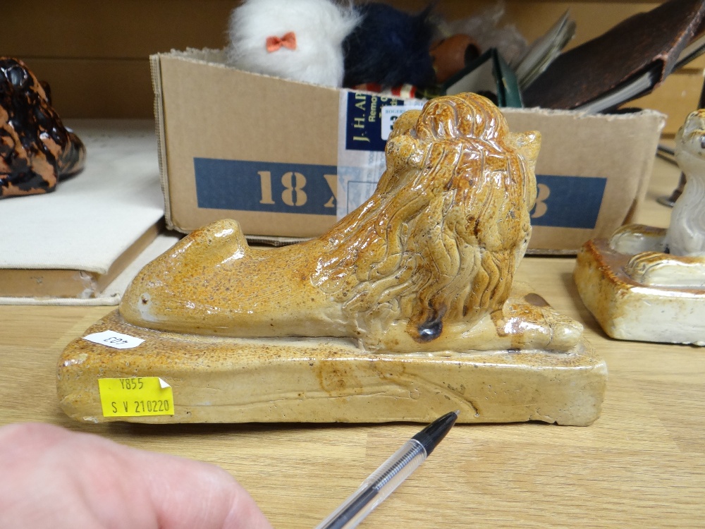 THREE SALTGLAZED POTTERY LIONS of recumbent form on plinths, largest 22cms wide, and a pottery - Image 3 of 23